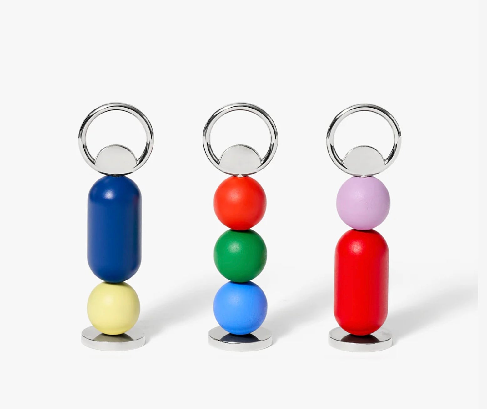 Three colorful keychains with beads on a white background