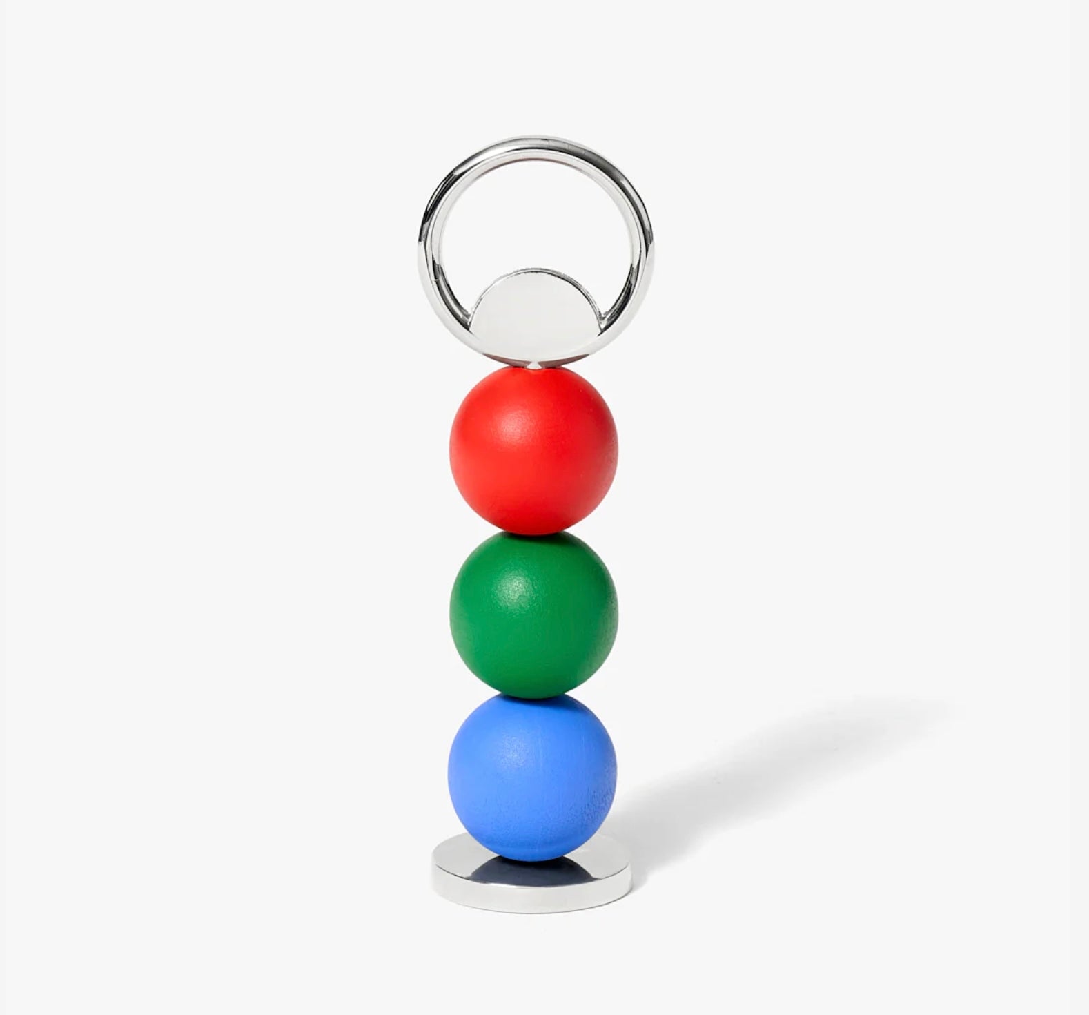 Bottle opener with three stacked colored balls on a white background