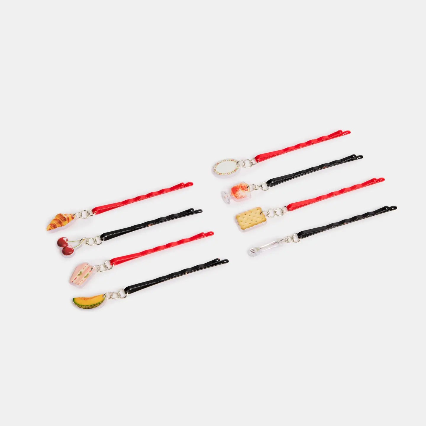 Set of black and red Bobby pins  with various charms