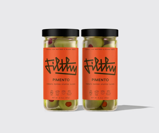 Filthy Pimento Stuffed Olives in jar with orange label